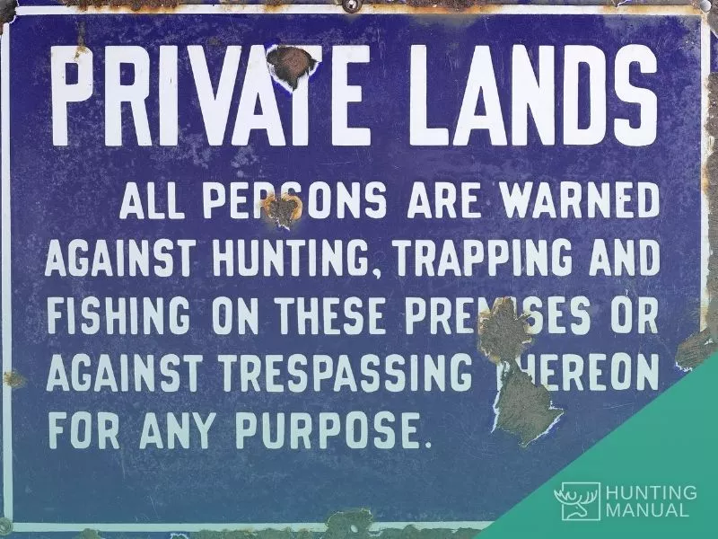 a sign board saying private lands not for hunting