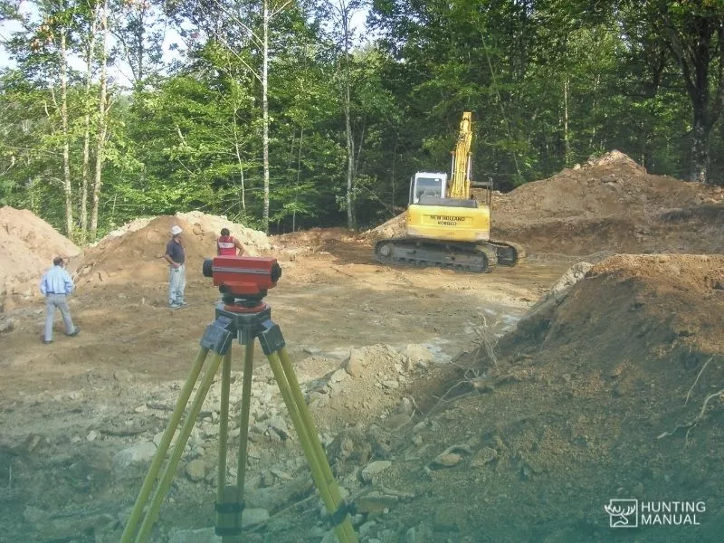 laser range measuring device during land mapping and construction in forest